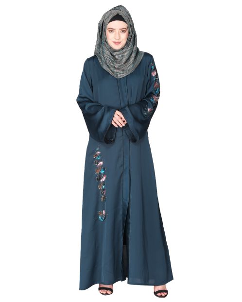 Opulent hand embroidered front open bottle green abaya with a unique twisted motif of sparkling sequins